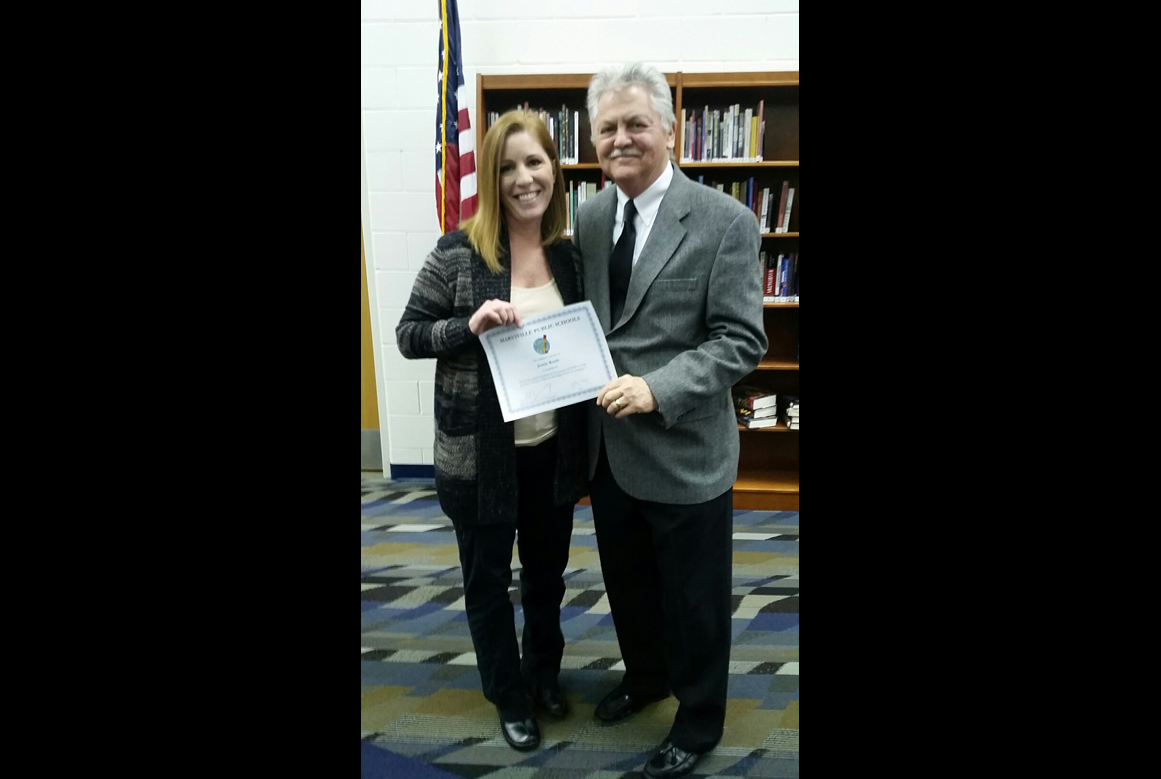 Mrs. Roehl with Superintendent holding certificate